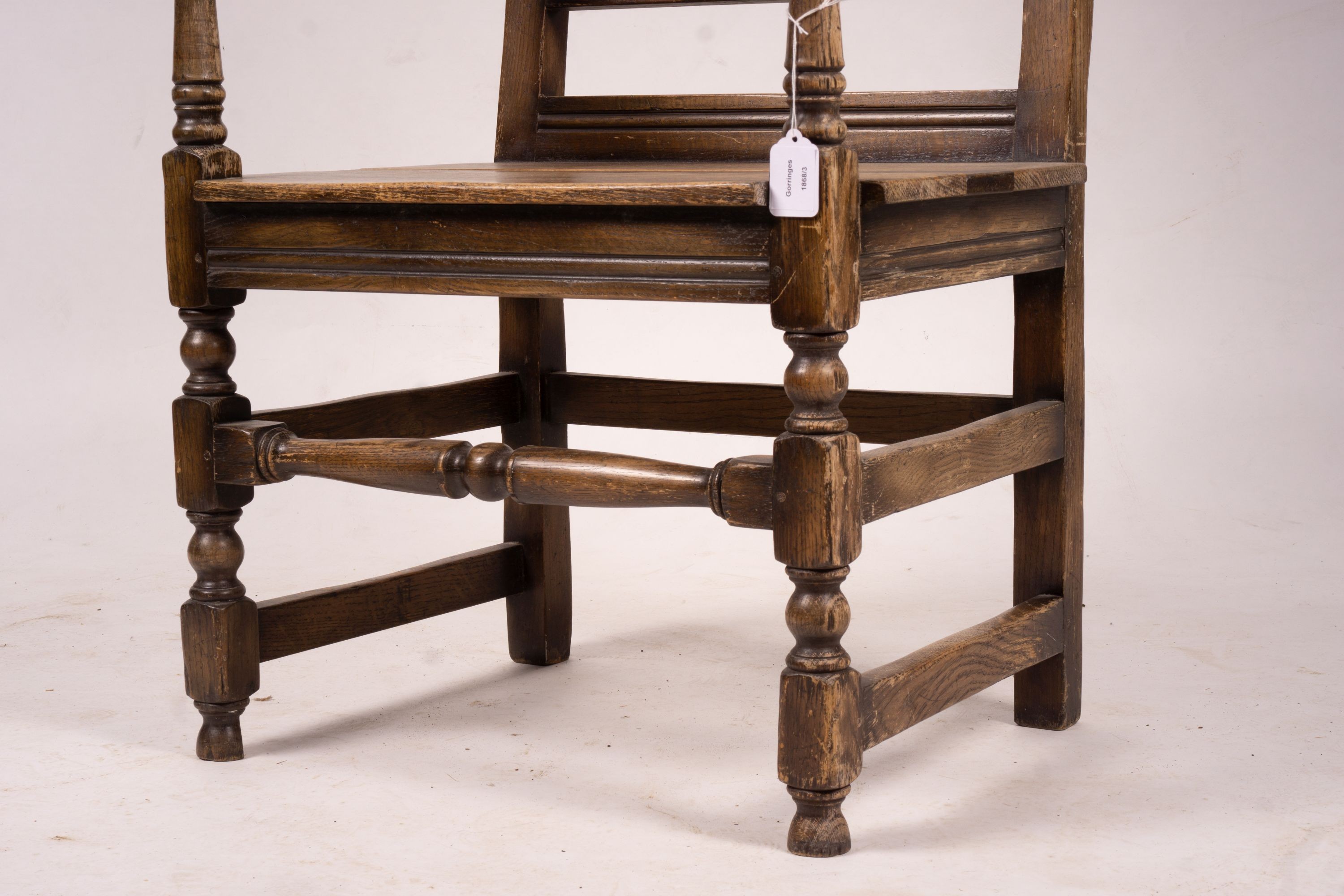 An early 20th century carved oak wainscot chair